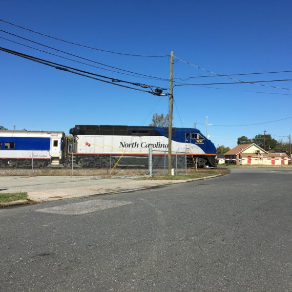 Train passing through railroad crossing